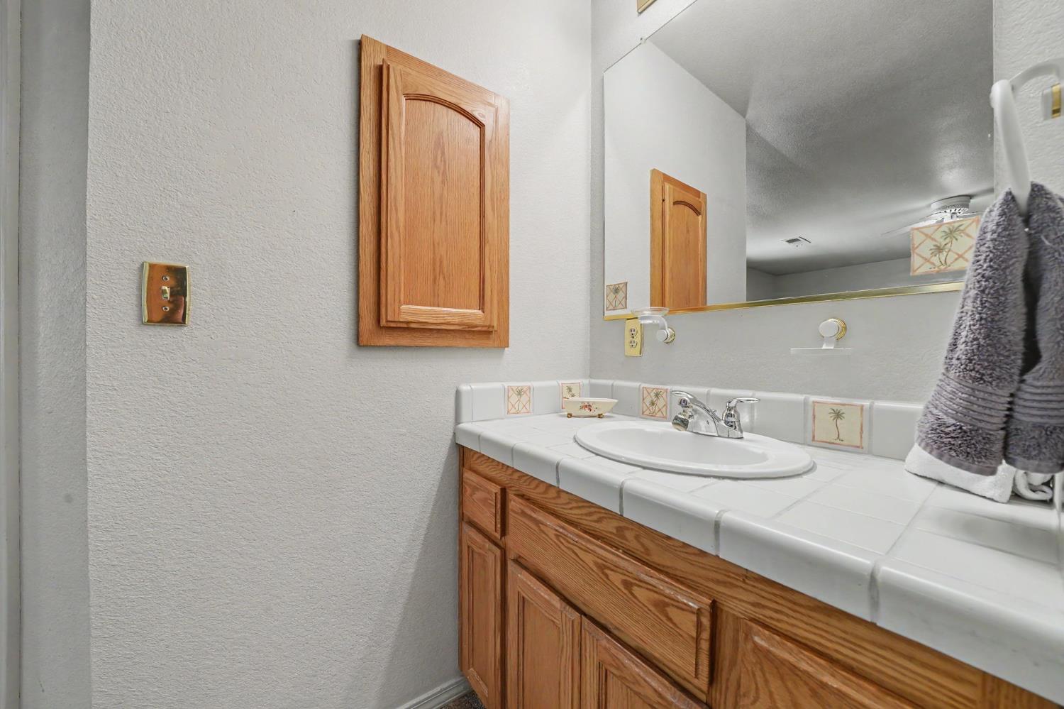 20310 State Rte 26 West Point, CA 95255 - Photo 24 of 57 a bathroom with a sink and a mirror