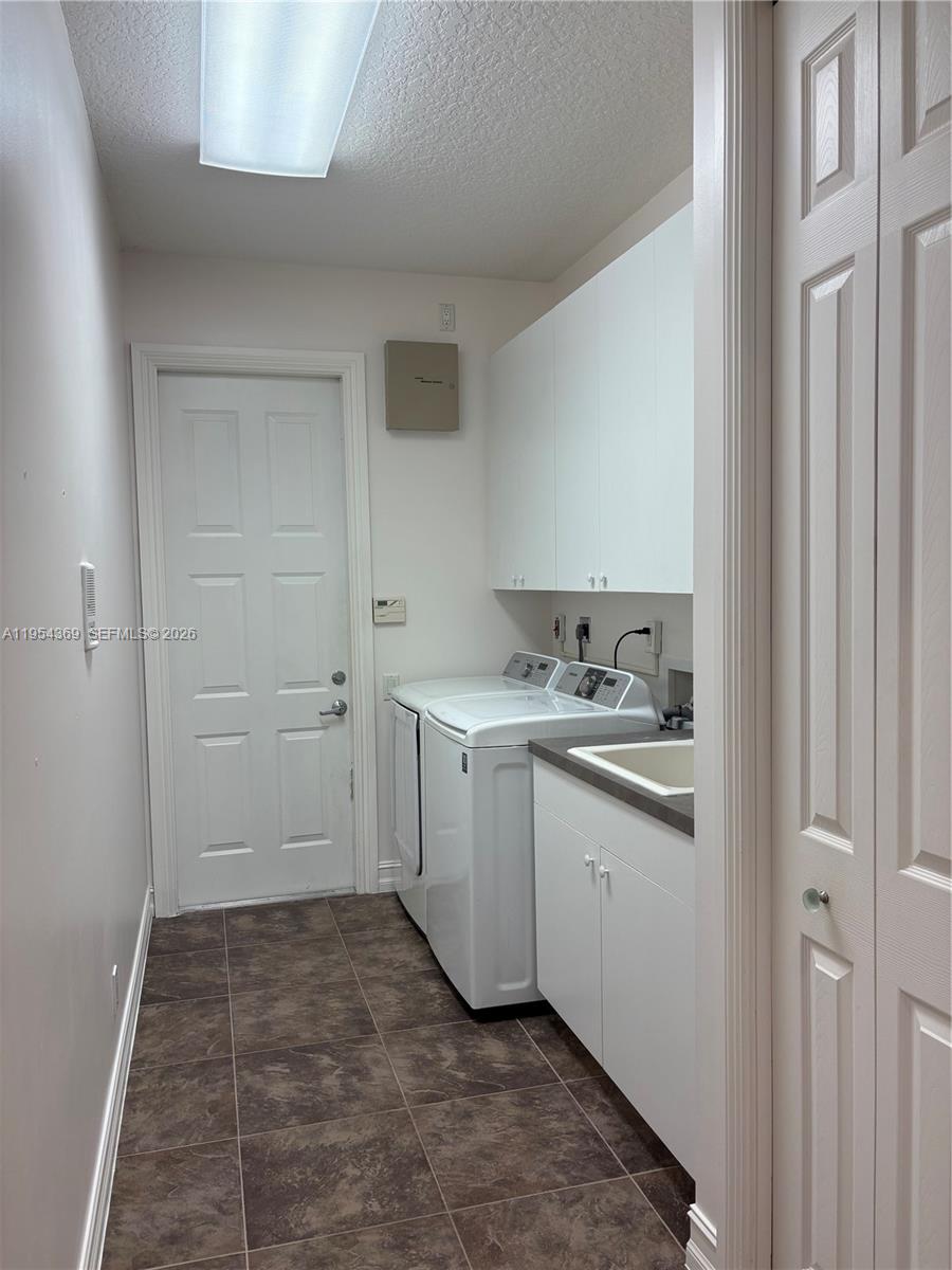 18265 Southeast Ridgeview Drive Tequesta, FL 33469 - Photo 4 of 12 a bathroom with a sink and a mirror