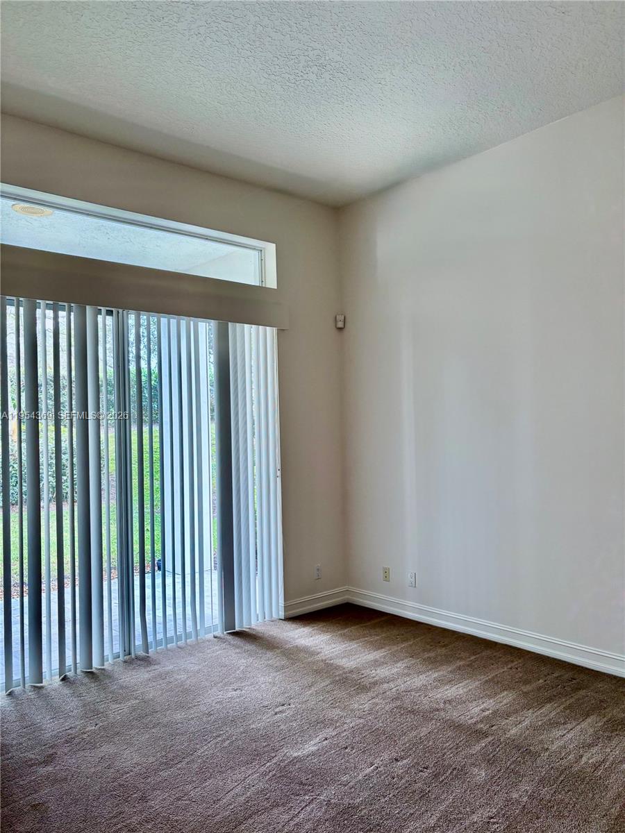 18265 Southeast Ridgeview Drive Tequesta, FL 33469 - Photo 6 of 12 a view of a room has an empty space and a window