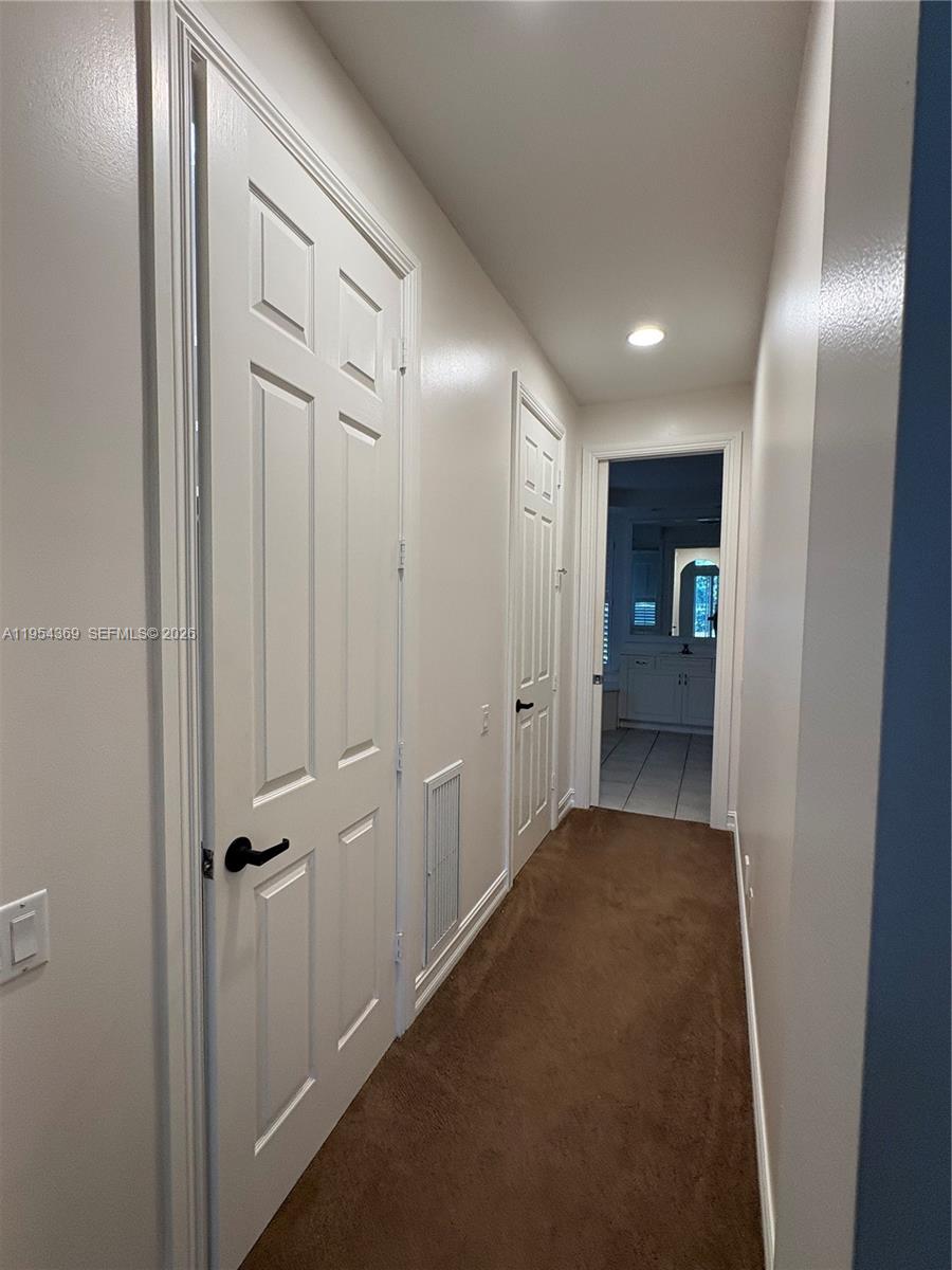 18265 Southeast Ridgeview Drive Tequesta, FL 33469 - Photo 7 of 12 a view of a hallway with closet area