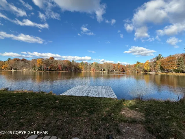 a view of a lake with houses in the back