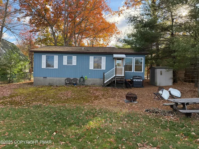 a backyard of a house with seating space