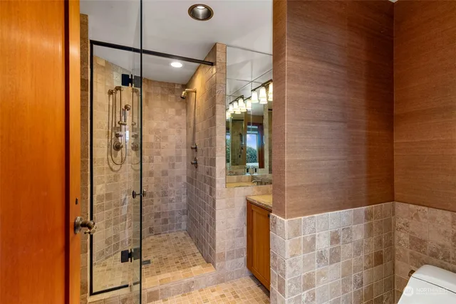 a bathroom with a shower and a sink