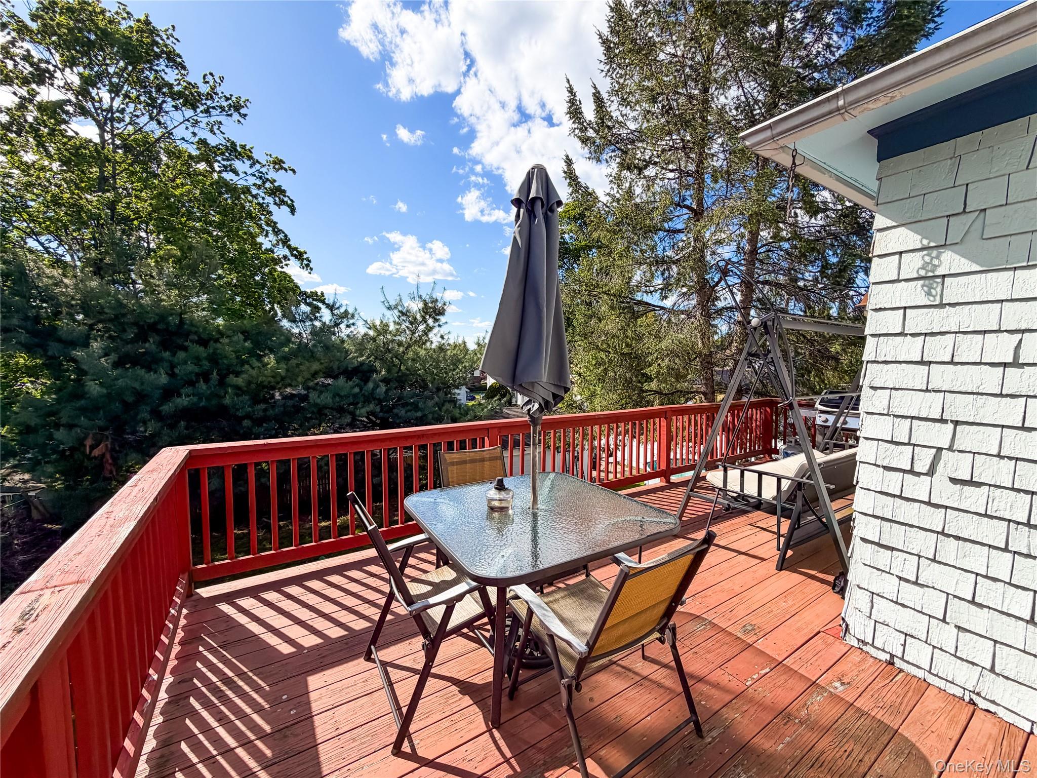 350 Smith Street Peekskill, NY 10566 - Photo 31 of 32 a view of balcony with wooden floor and outdoor seating