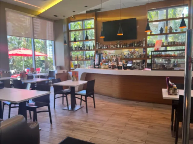 a hallway with a bench in dining room