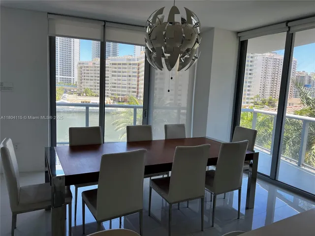 a view of a dining room with furniture window and outside view
