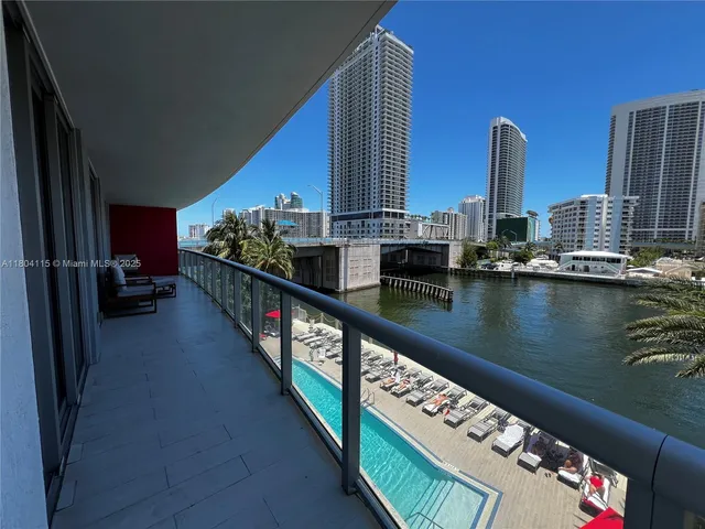 a view of two chairs in the balcony