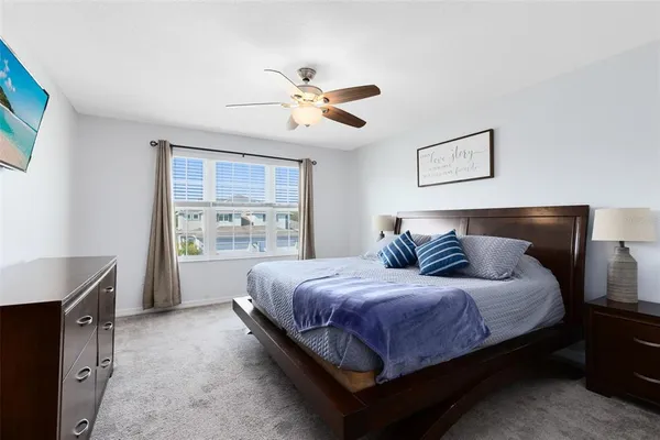 a bedroom with a bed and a dresser