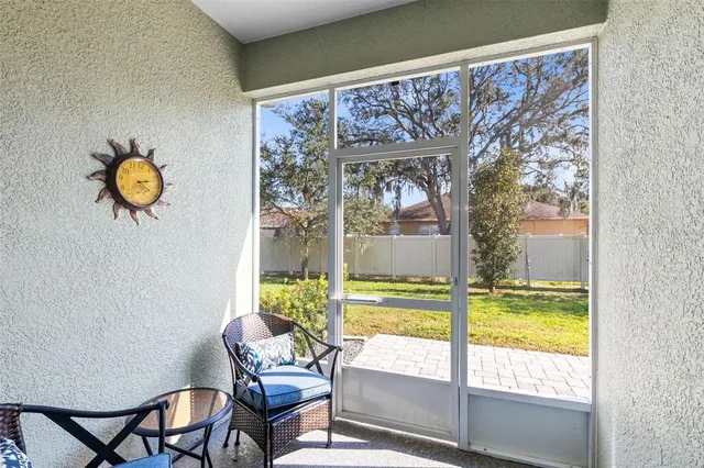 a view of a house with swimming pool and sitting area