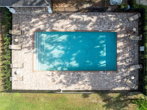 a view of a swimming pool with a lake view
