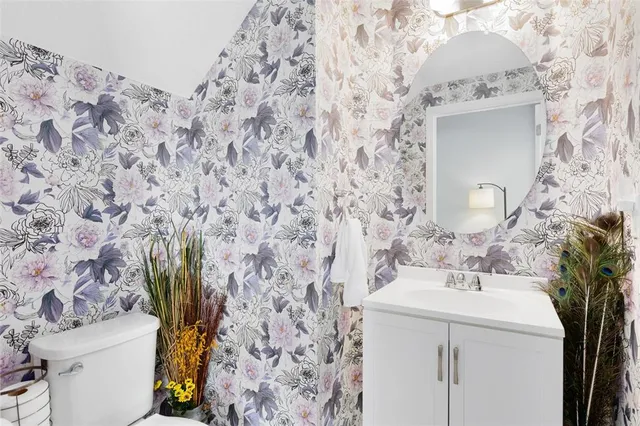 a living room with furniture a chandelier and a window