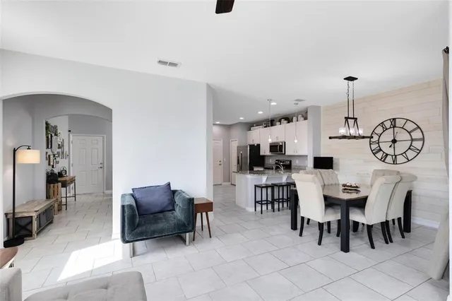 a view of a dining room that has a table and chairs