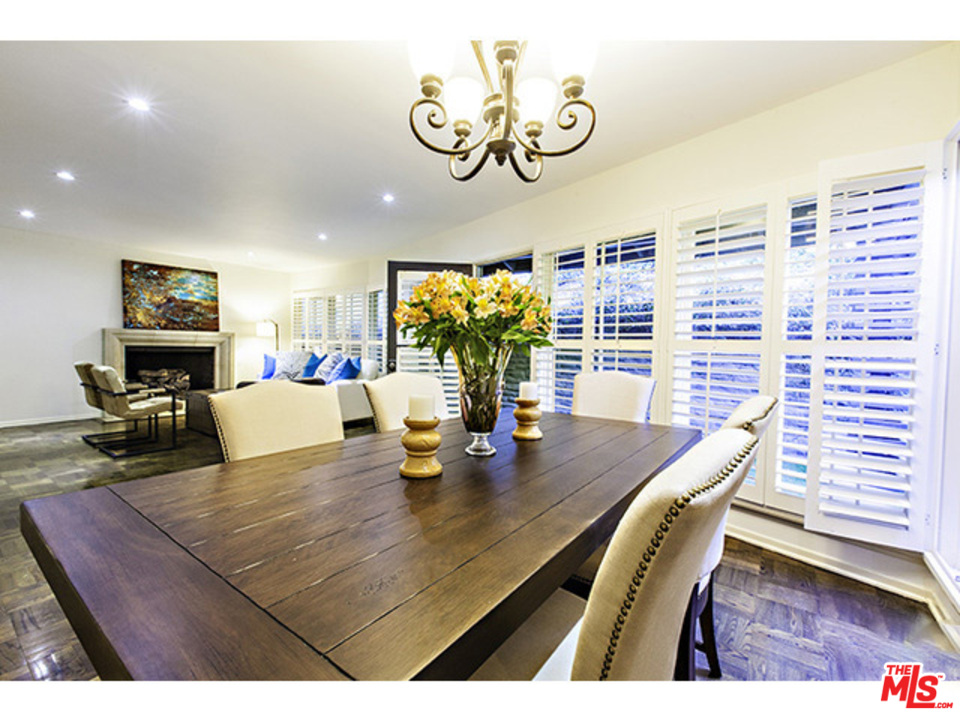 2559 Hutton Drive Beverly Hills, CA 90210 - Photo 2 of 13 a view of a dining room with furniture a chandelier and wooden floor