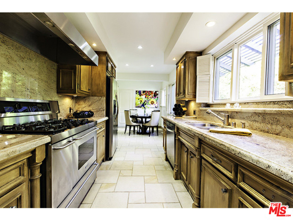 2559 Hutton Drive Beverly Hills, CA 90210 - Photo 3 of 13 a kitchen with stainless steel appliances granite countertop a stove and a sink