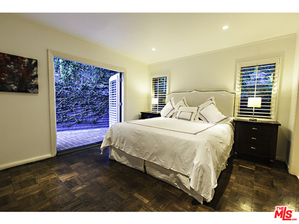 2559 Hutton Drive Beverly Hills, CA 90210 - Photo 5 of 13 a bedroom with a bed and a night stand