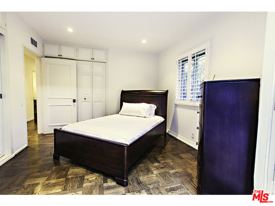 2559 Hutton Drive Beverly Hills, CA 90210 - Photo 9 of 13 a bedroom with a bed and a table