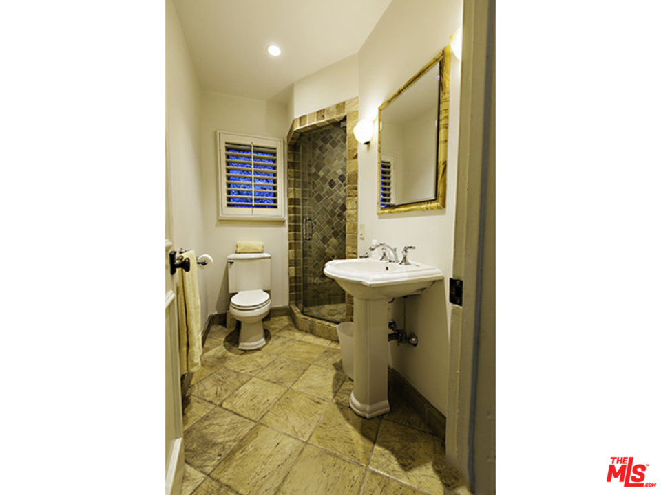 2559 Hutton Drive Beverly Hills, CA 90210 - Photo 10 of 13 a bathroom with a sink toilet and shower