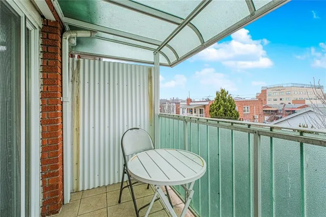 a view of a balcony with furniture