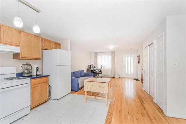 a kitchen with stainless steel appliances kitchen island granite countertop a sink and cabinets