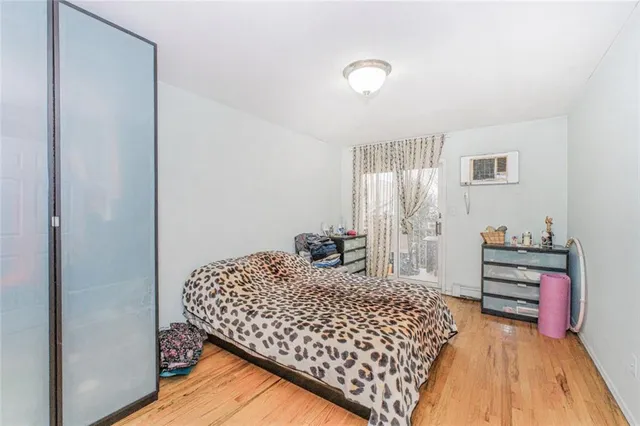 a bedroom with a bed and a cabinets