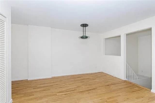 a view of empty room with ceiling fan