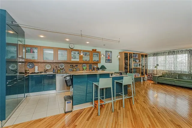 a open kitchen with a table and chairs in it