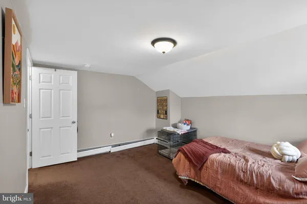 a bedroom with a bed and closet