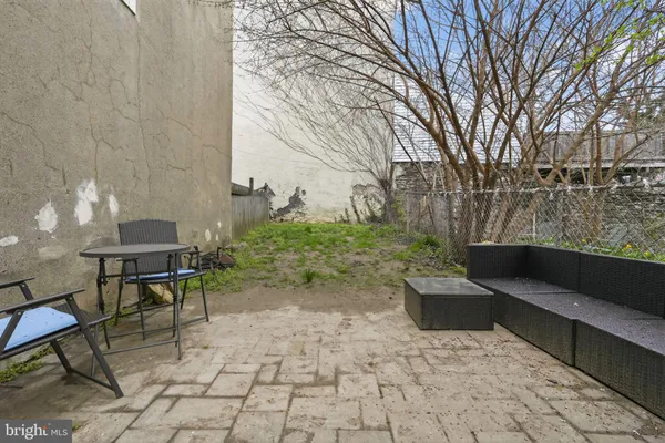 a view of a yard with furniture