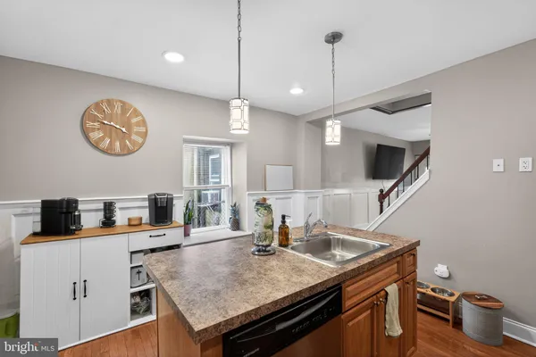 a kitchen with a table and chairs in it