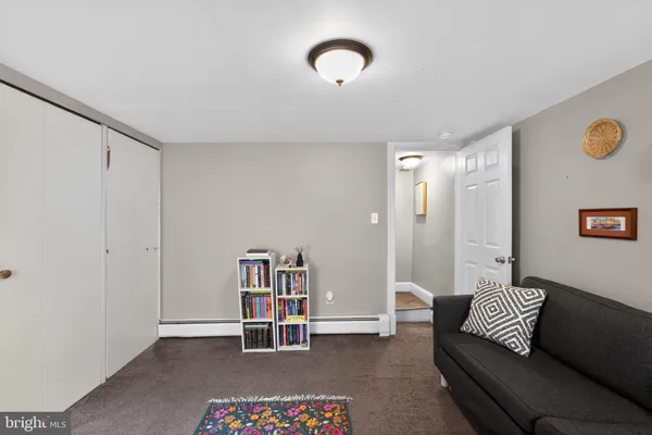 a living room with furniture and a rug