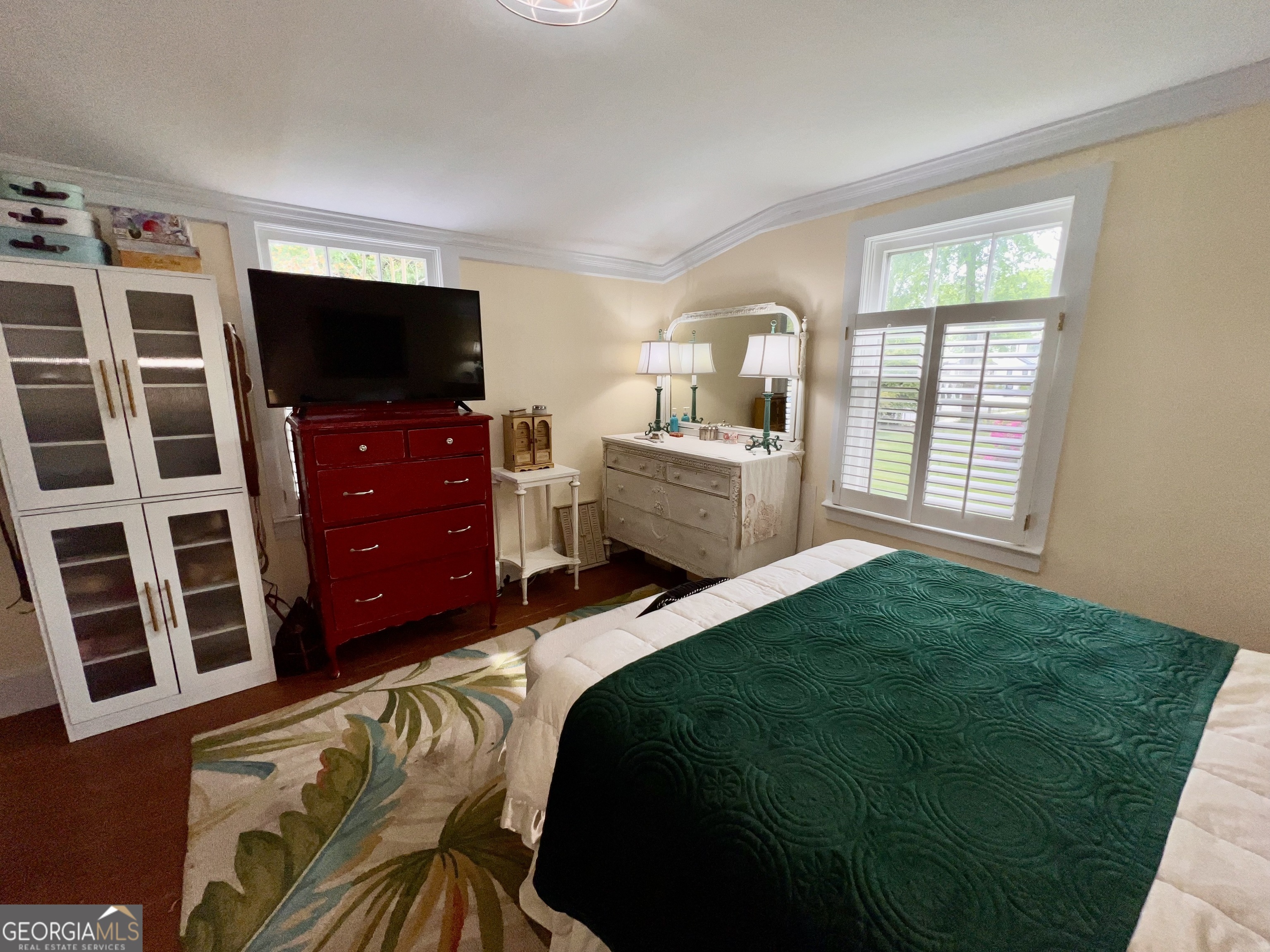 600 Foster Street Madison, GA 30650 - Photo 24 of 54 a bedroom with a bed and a flat screen tv