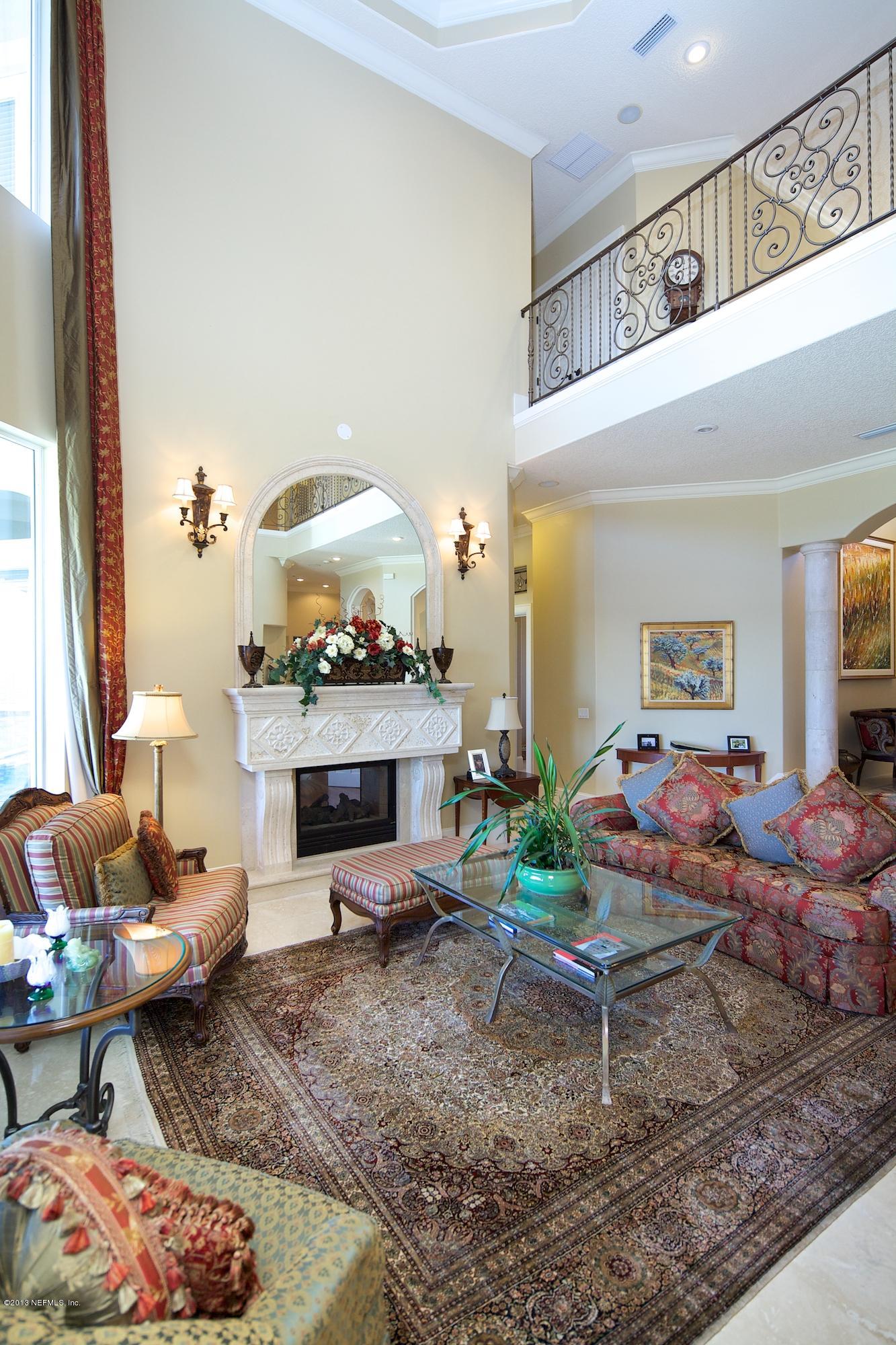12946 Mandarin Road Jacksonville, FL 32223 - Photo 12 of 67 a living room with furniture and a fireplace