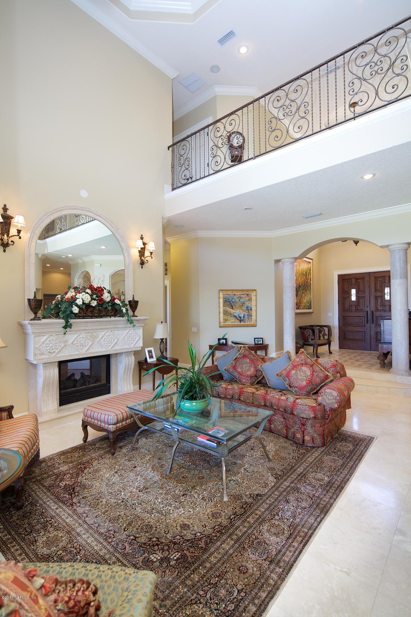 12946 Mandarin Road Jacksonville, FL 32223 - Photo 13 of 67 a living room with furniture and a fireplace