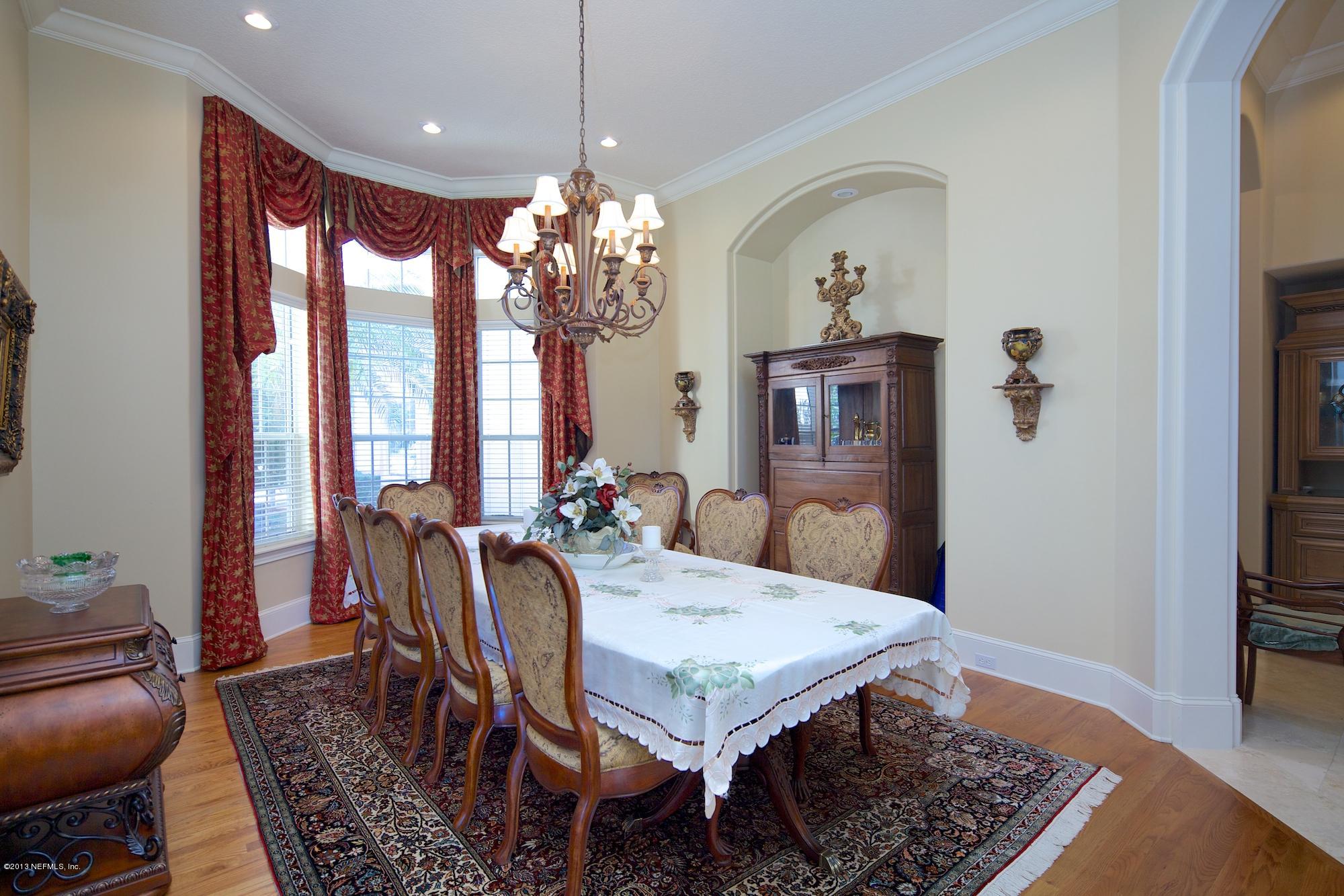 12946 Mandarin Road Jacksonville, FL 32223 - Photo 15 of 67 a view of a dining room with furniture window and wooden floor