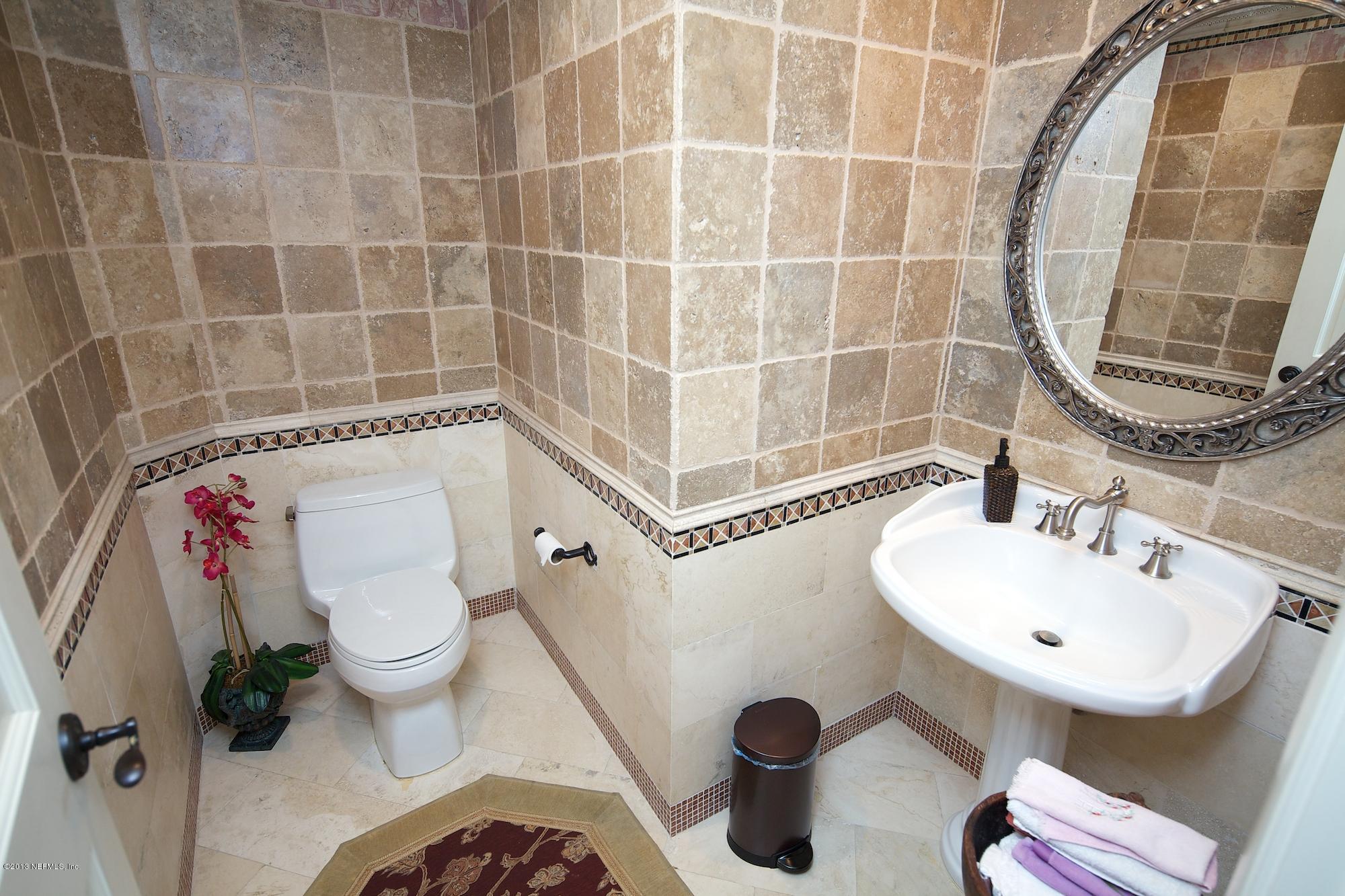 12946 Mandarin Road Jacksonville, FL 32223 - Photo 19 of 67 a bathroom with a sink toilet and shower