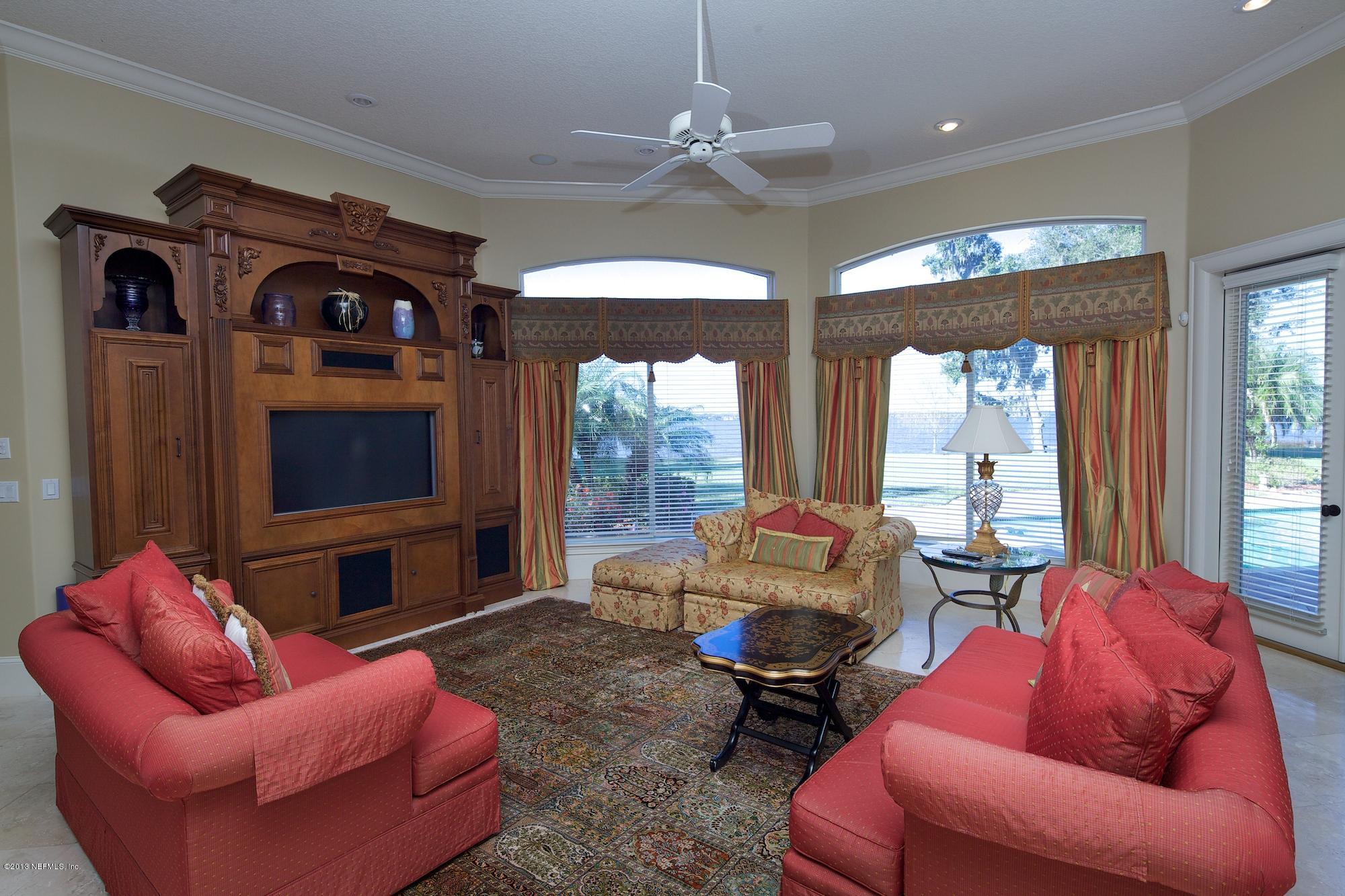 12946 Mandarin Road Jacksonville, FL 32223 - Photo 20 of 67 a living room with furniture or outdoor view and a large window