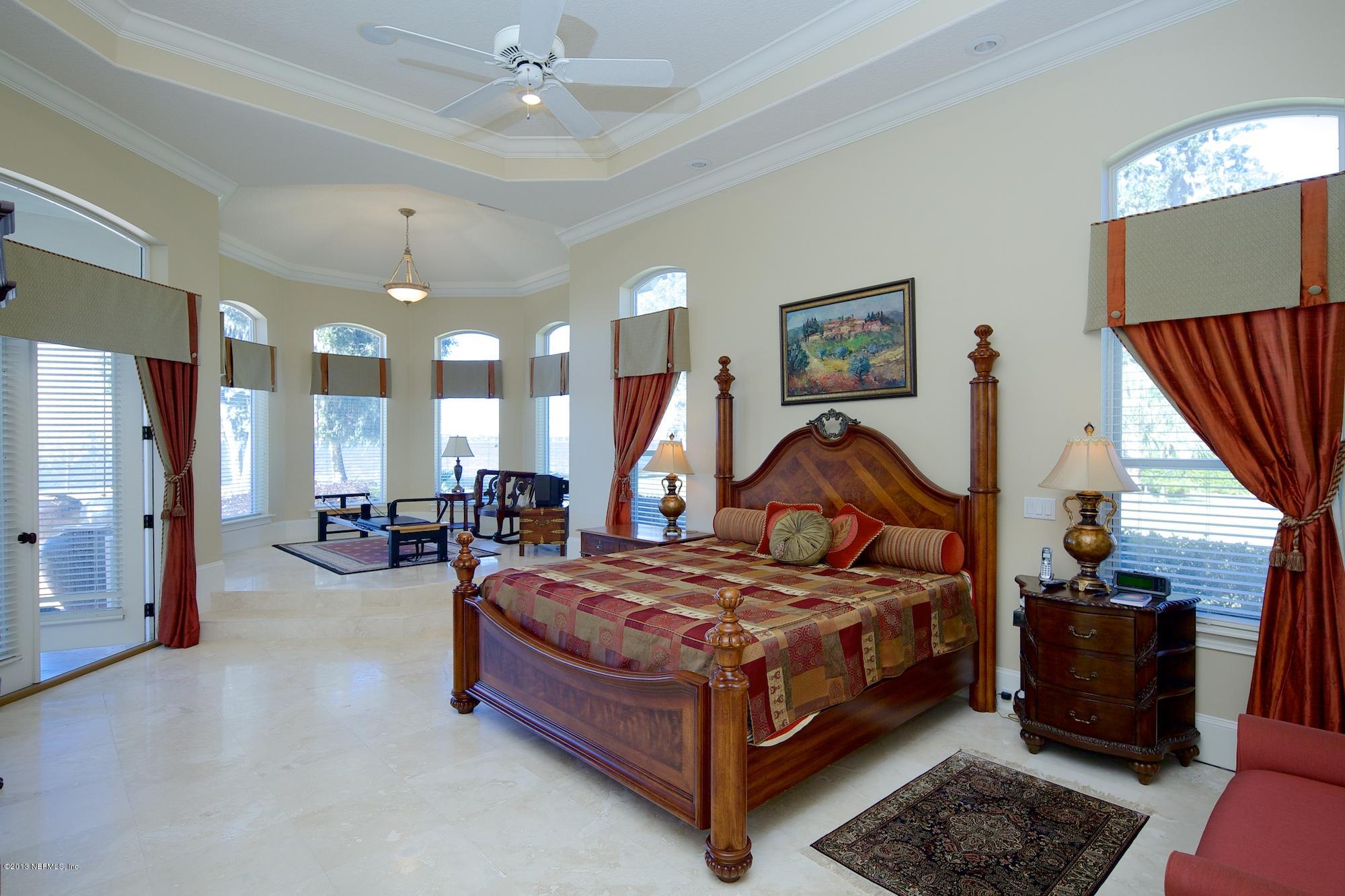 12946 Mandarin Road Jacksonville, FL 32223 - Photo 25 of 67 a bedroom with a bed and wooden floor