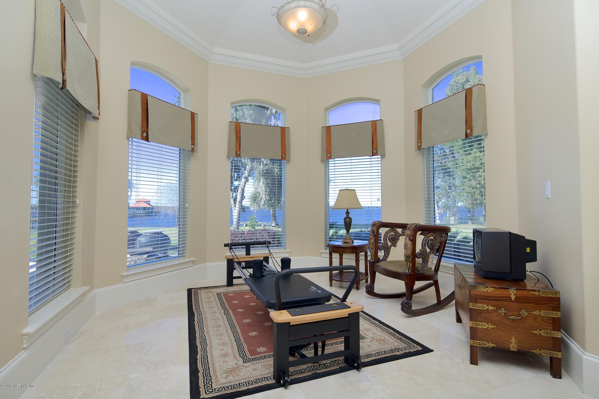 12946 Mandarin Road Jacksonville, FL 32223 - Photo 26 of 67 a living room with furniture and a window