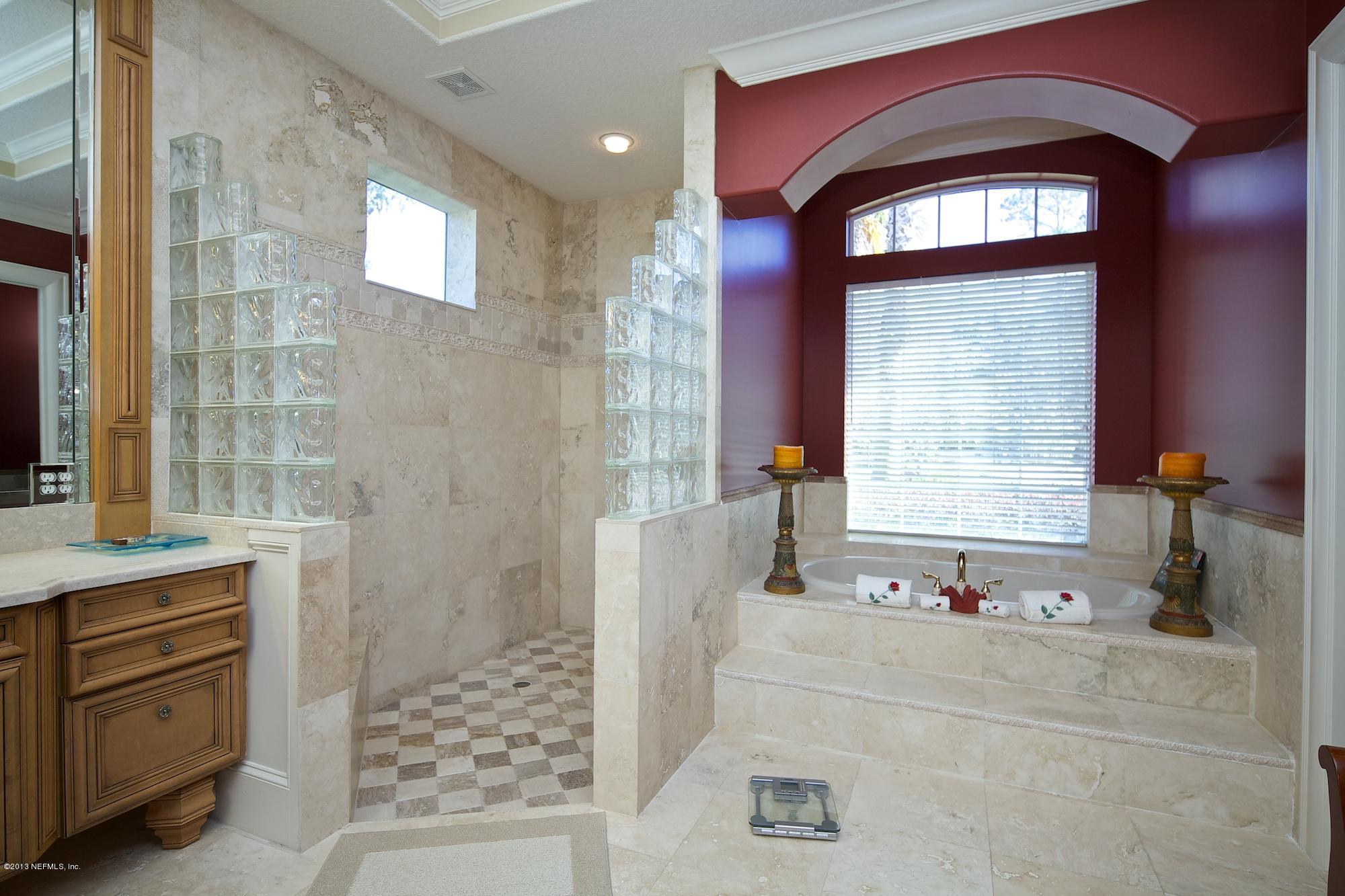 12946 Mandarin Road Jacksonville, FL 32223 - Photo 28 of 67 a bathroom with a bathtub and a sink