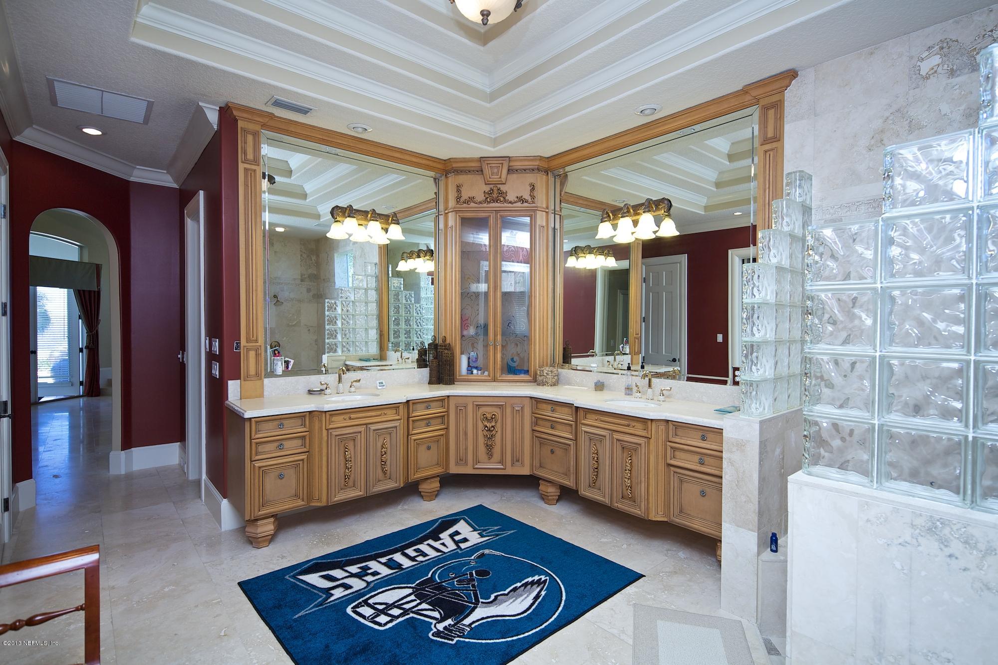 12946 Mandarin Road Jacksonville, FL 32223 - Photo 29 of 67 a large bathroom with a large tub and sink
