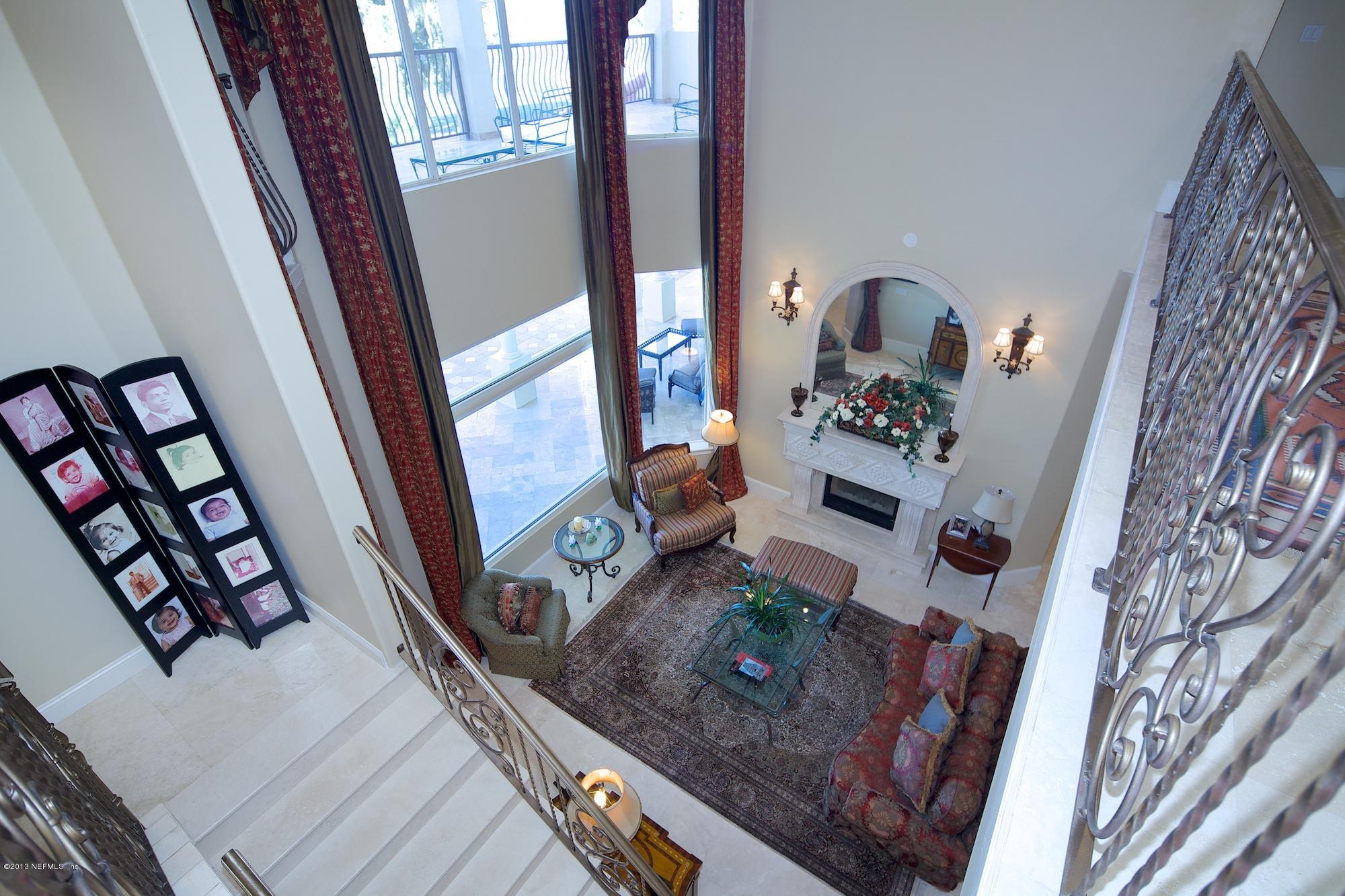 12946 Mandarin Road Jacksonville, FL 32223 - Photo 34 of 67 a living room with furniture and a fireplace