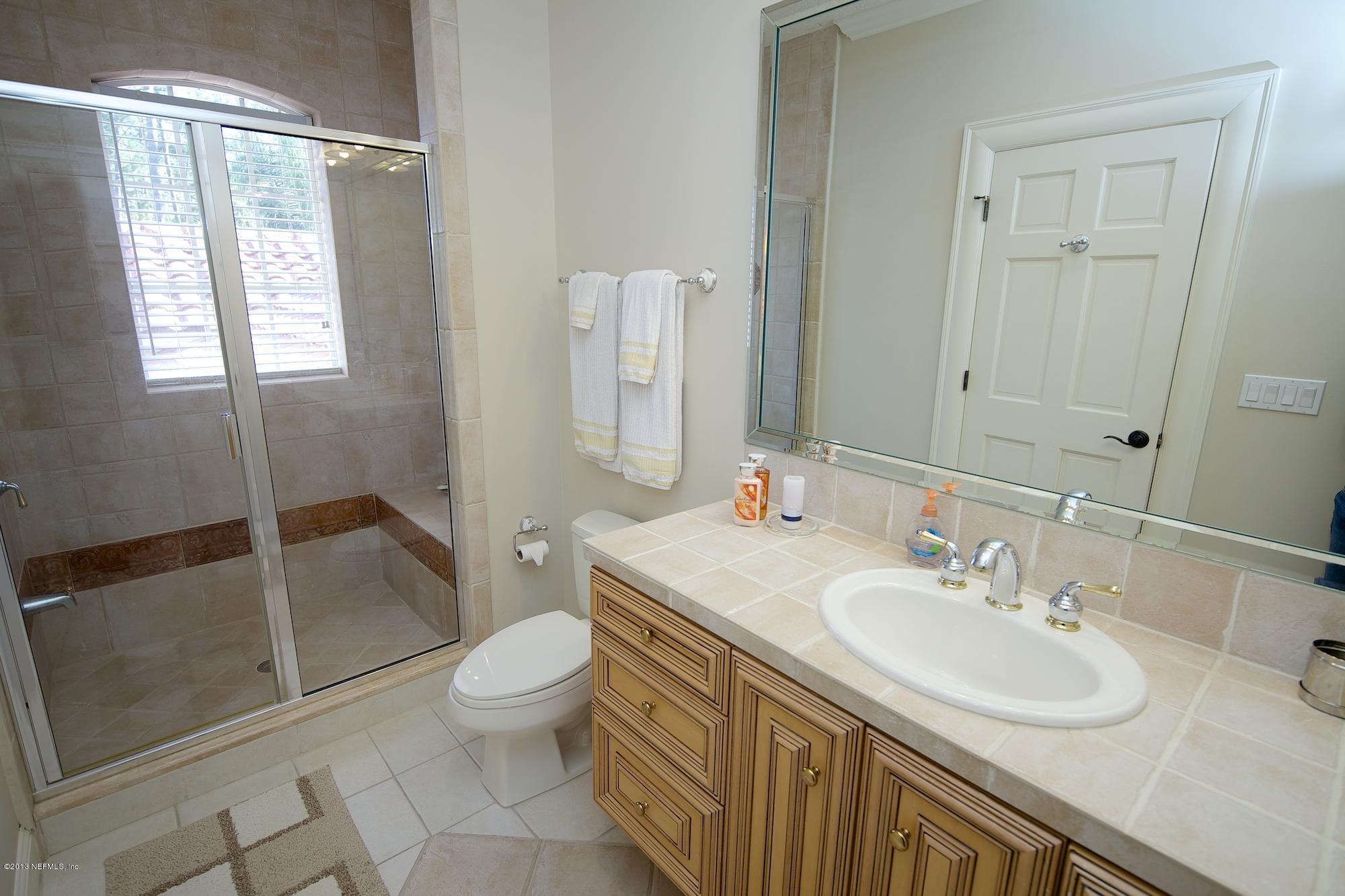 12946 Mandarin Road Jacksonville, FL 32223 - Photo 39 of 67 a bathroom with a sink toilet and shower