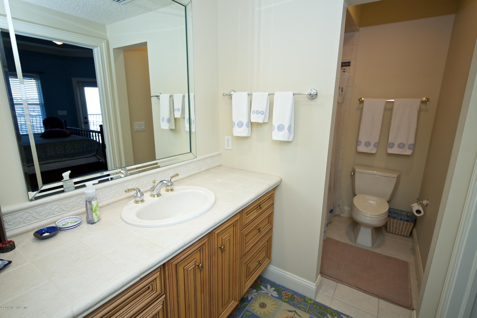 12946 Mandarin Road Jacksonville, FL 32223 - Photo 41 of 67 a bathroom with a double vanity sink and mirror