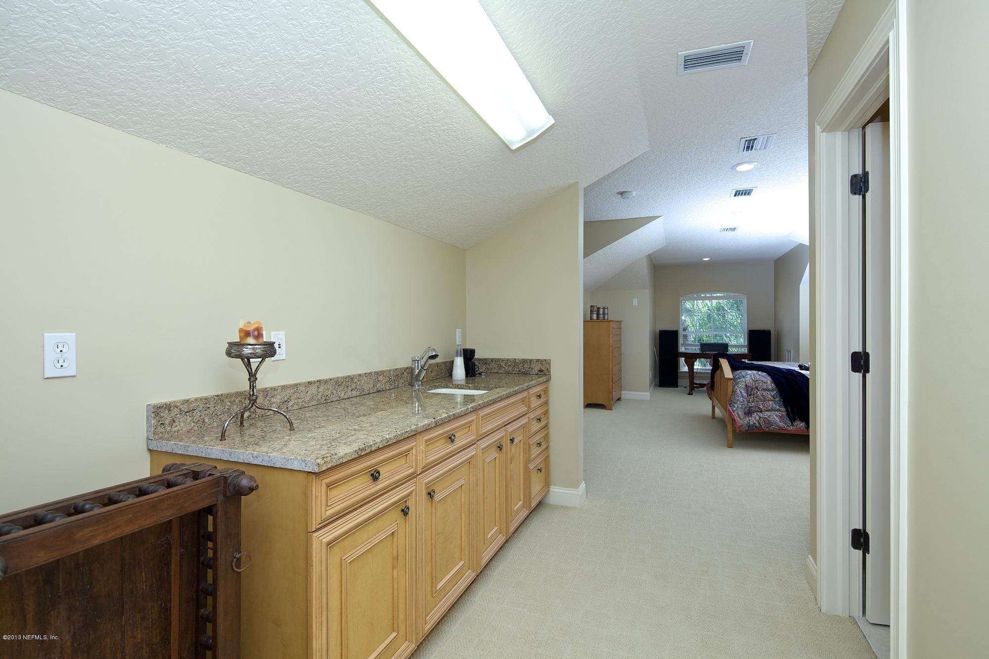 12946 Mandarin Road Jacksonville, FL 32223 - Photo 47 of 67 a en suite bathroom with a granite countertop sink and a mirror