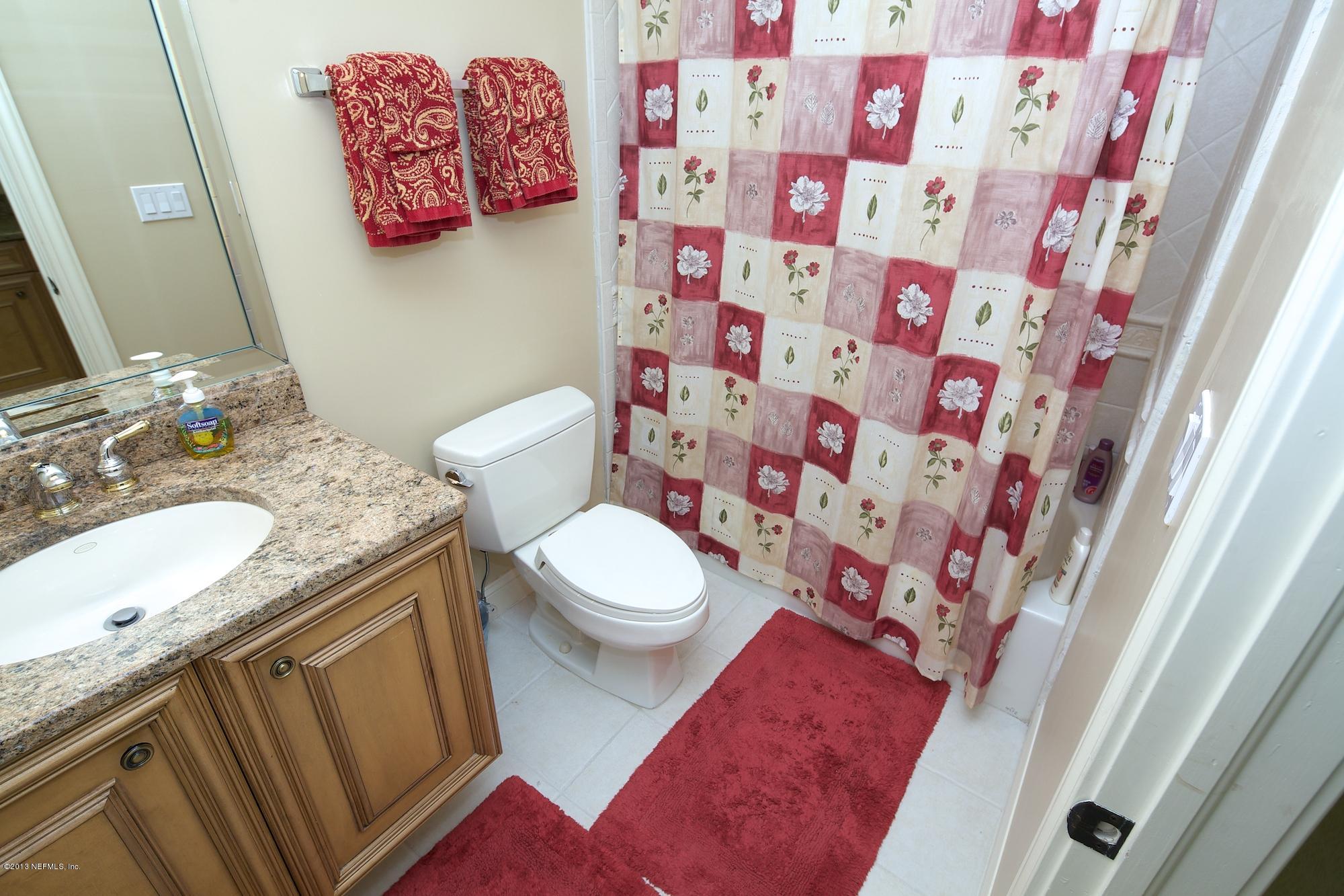12946 Mandarin Road Jacksonville, FL 32223 - Photo 48 of 67 a bathroom with a granite countertop sink and a toilet