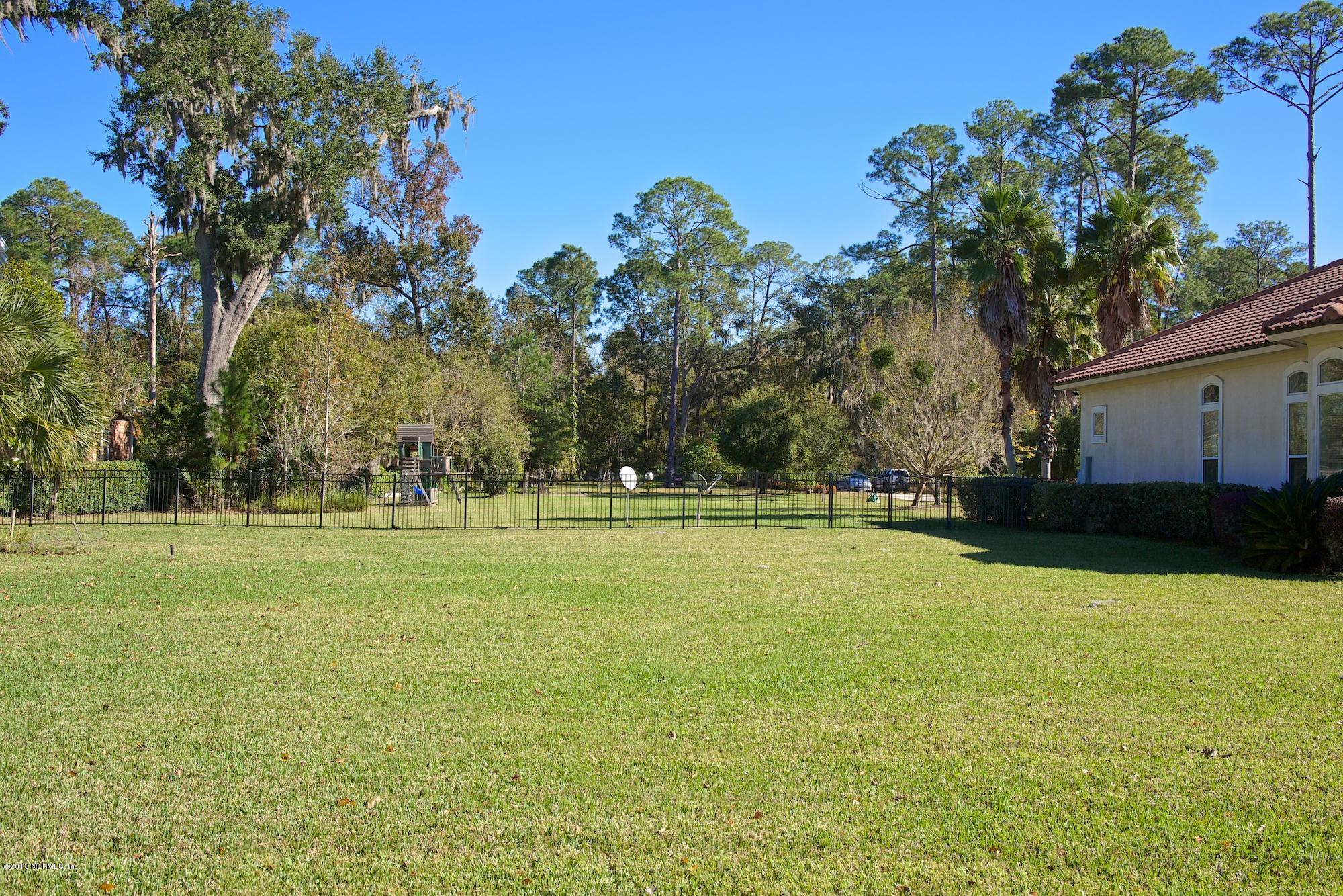 12946 Mandarin Road Jacksonville, FL 32223 - Photo 56 of 67 a view of pool and trees in the background