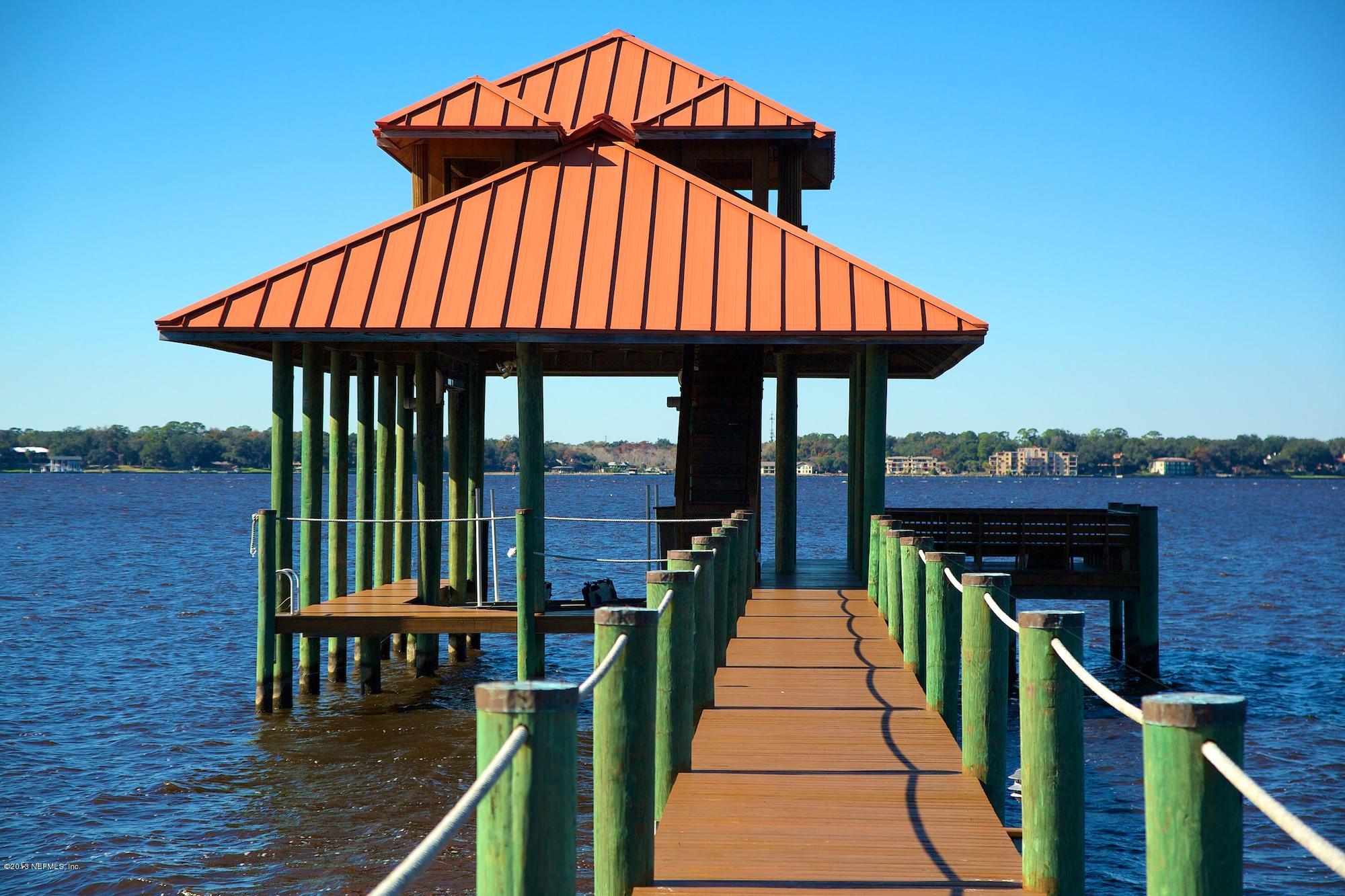 12946 Mandarin Road Jacksonville, FL 32223 - Photo 58 of 67 a view of a roof deck with chair and wooden floor