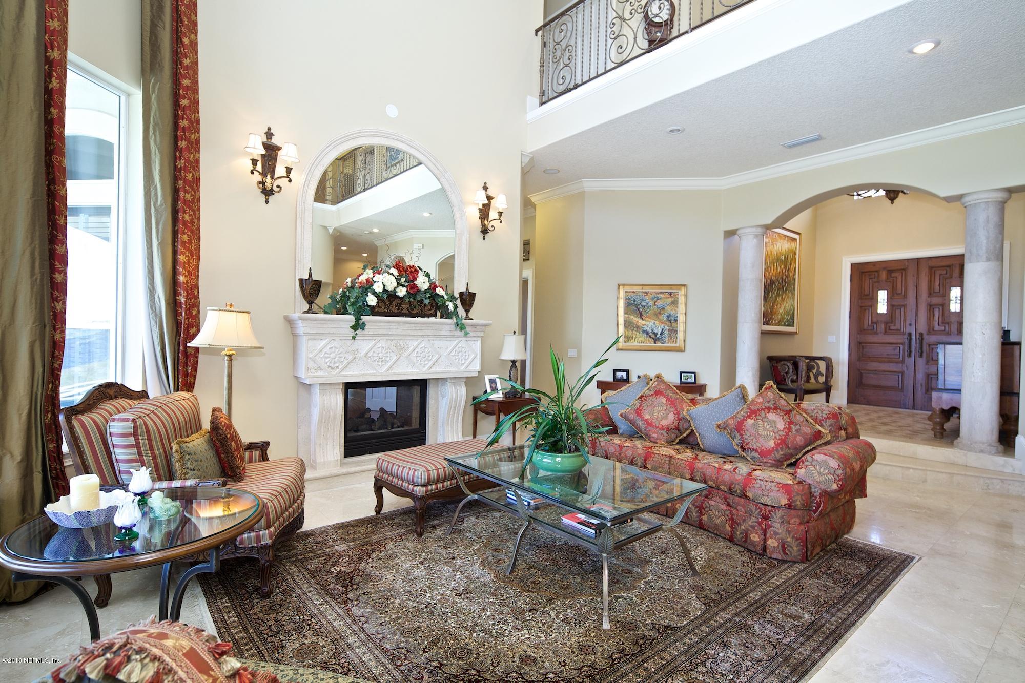 12946 Mandarin Road Jacksonville, FL 32223 - Photo 10 of 67 a living room with furniture and a fireplace