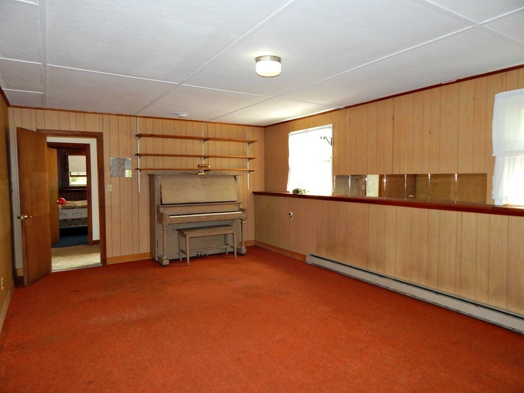 174 Ayer Road Shirley, MA 01464 - Photo 13 of 30 wooden floor in an empty room with a window