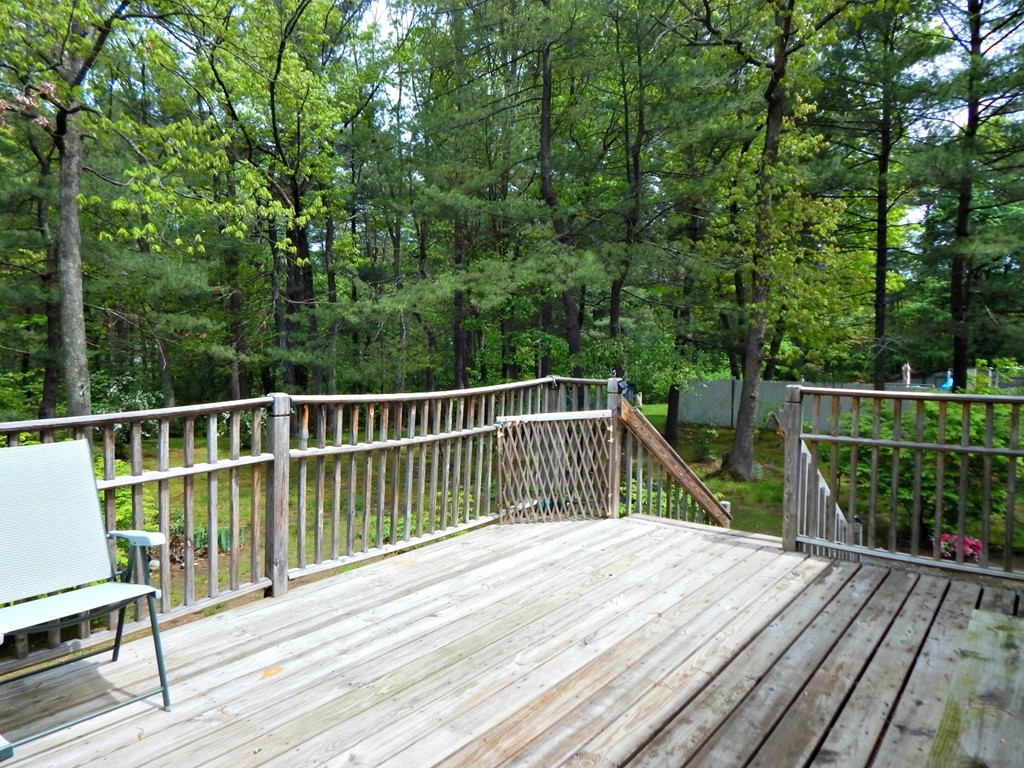 174 Ayer Road Shirley, MA 01464 - Photo 17 of 30 a balcony with view of trees in front of it